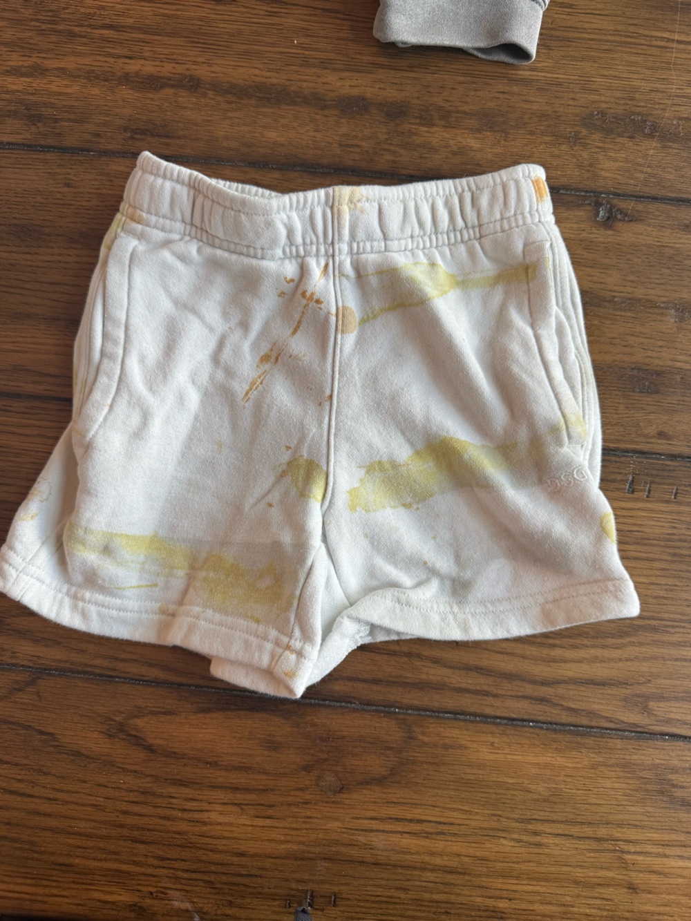 DSG White Shorts with Sunny Yellow Paint Splat Detail